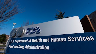 A sign for the Food and Drug Administration is seen in Silver Spring, Md., on Thursday, Dec. 10, 2020. On Wednesday, March 30, 2022, federal health advisers narrowly ruled against an experimental drug for the debilitating illness known as Lou Gehrig’s disease, a potential setback for patient groups who lobbied for the medication’s approval. A majority of advisers to the FDA voted 6-4 that a single study from Amylyx Pharmaceuticals failed to establish the drug's effectiveness in treating the deadly neurodegenerative disease known also as ALS, for amyotrophic lateral sclerosis.