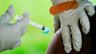 In this Sept. 14, 2021, file photo, a health worker administers a dose of a Pfizer COVID-19 vaccine during a vaccination clinic in Reading, Pa. Pfizer, Thursday, April 14, 2022, wants to expand its COVID-19 booster shots to healthy 5- to 11-year-olds. U.S. health authorities already urge everyone 12 and older to get one booster dose for the best protection. And those 50 and older have the option of a second booster.