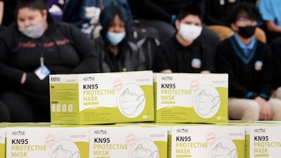 Boxes of KN95 protective masks are stacked together before being distributed to students at Camden High School in Camden, N.J., Wednesday, Feb. 9, 2022. According to a study by the Centers for Disease Control and Prevention released Tuesday, April 26, 2022, three out of every four U.S. children have been infected with COVID-19.