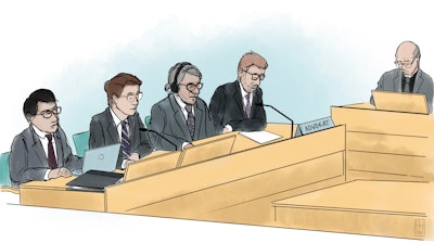An artists impression from the trial of surgeon Paolo Macchiarini, third left, with his lawyer Bjorn Hurtigin, at left, in Solna District Court, Solna, Sweden, Wendsday, April 27, 2022. A surgeon who made headlines in 2011 for carrying out the world’s first stem-cell windpipe transplants at Sweden’s leading hospital is on trial accused of aggravated assault against three of his patients. Italian stem-cell scientist Dr. Paolo Macchiarini was once considered a leading figure in regenerative medicine and is credited with creating the world’s first windpipe partially made from a patient’s own stem cells. Sweden decided in December 2018 to reopen a previously discontinued investigation into three cases.