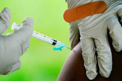 A health worker administers a dose of COVID-19 vaccine during a vaccination clinic in Reading, Pa. COVID-19 vaccinations are at a critical juncture as companies test whether new approaches like combination shots or nasal drops can keep up with a mutating coronavirus — even though it’s not clear if any change is needed.