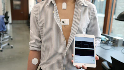 Volunteer showing the full 'body-area network' with all devices.