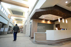 A man walks through the lobby of Thomasville Regional Medical Center in Thomasville, Ala., on Tuesday, May 3, 2022. The hospital is among three in the nation that say they are missing out on federal pandemic relief money because they opened during or shortly before the COVID-19 crisis began.