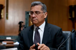 Health and Human Services Secretary Xavier Becerra arrives for a hearing on Capitol Hill in Washington, April 5, 2022. Medicare recipients will get a premium reduction — but not until next year. That reflects what Becerra says was an overestimate in costs of covering a costly and controversial new Alzheimer's drug.