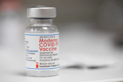 A vial of the Moderna COVID-19 vaccine is displayed on a counter at a pharmacy in Portland, Ore. on Dec. 27, 2021. A government advisory panel met Tuesday, June 14, 2022, to decide whether to recommend a second brand of COVID-19 vaccine for school-age children and teens. The Food and Drug Administration's outside experts will vote on whether Moderna's vaccine is safe and effective enough to give kids ages 6 to 17. If the panel endorses the shot and the FDA agrees, it would become the second option for those children, joining Pfizer's vaccine.