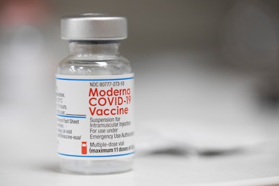 A vial of the Moderna COVID-19 vaccine is displayed on a counter at a pharmacy in Portland, Ore. on Dec. 27, 2021. A government advisory panel met Tuesday, June 14, 2022, to decide whether to recommend a second brand of COVID-19 vaccine for school-age children and teens. The Food and Drug Administration's outside experts will vote on whether Moderna's vaccine is safe and effective enough to give kids ages 6 to 17. If the panel endorses the shot and the FDA agrees, it would become the second option for those children, joining Pfizer's vaccine.