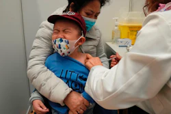 A boy receives a dose of China's Sinovac COVID-19 coronavirus vaccine at a community vaccination center in Hong Kong on Feb. 25, 2022. U.S. government advisers met Wednesday, June 15, 2022 to decide whether to endorse COVID-19 shots for babies, toddlers and preschoolers, moving the nation closer to vaccinations for all ages. According to the World Health Organization, 12 countries are vaccinating kids under 5.