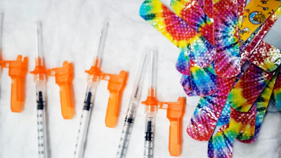 Syringes and colorful bandages are prepared as children from local schools prepare to get COVID-19 vaccines in Pittsfield, Mass., on Monday Dec. 13, 2021.