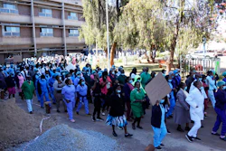 Health workers led by nurses take part in a demonstration over salaries at Parerenyatwa Hospital in Harare, Tuesday, June, 21, 2022. A strike by health workers has left Zimbabwe's major hospitals in near paralysis, putting further strain on a public health system already in a dire state.