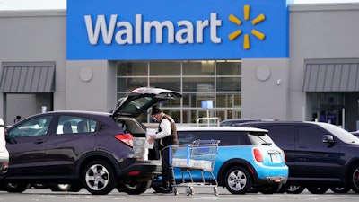 Shown is a Walmart location in Philadelphia, Wednesday, Nov. 17, 2021. Walmart, the nation’s largest retailer, on Wednesday, June 22, 2022, is expanding its healthcare coverage of so-called doula services beyond its workers in Georgia to Louisiana, Indiana and Illinois in an effort to address racial inequities in maternal care. With this move, workers can take advantage of financial support to cover care by doulas— experts who are trained to help support mothers through the labor process and delivery of the child _ up to $1,000 per pregnancy.