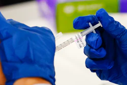 A health worker administers a dose of a Moderna COVID-19 vaccine during a vaccination clinic in Norristown, Pa. on Dec. 7, 2021. In a reversal for President Joe Biden, a federal appeals court in New Orleans on Monday, June 27, 2022, agreed to reconsider its own April ruling that allowed the administration to require federal employees to be vaccinated against COVID-19.