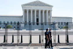 Security works outside of the Supreme Court, Thursday, June 30, 2022, in Washington.