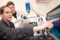 Catherine Dulac, (white shirt) and Jessica Osterhout, (black shirt) study how the brain controls symptoms of sickness, such as fever, and loss of appetite inside the Biology Labs.