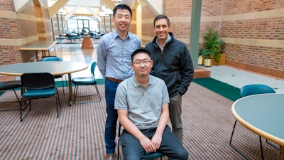 Researchers at the Beckman Institute developed an algorithm to rapidly measure and reconstruct whole-brain vasculature and blood flow. Their work could enhance future research into the mechanisms underlying conditions like Alzheimer's disease. Standing: Pengfei Song (left); Dan Llano. Seated: Qi You.
