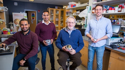 This photo shows the Wyss Institute’s team that developed the eRapid electrochemical biosensor technology. Shown from left to right are: Sanjay Sharma Timilsina, Ph.D., former Postdoctoral Fellow on the team; Pawan Jolly, Ph.D., Wyss Senior Staff Scientist; Donald Ingber, M.D., Ph.D., Wyss Founding Director; and Nolan Durr, former Wyss Research Assistant. Research engineers Timilsina and Durr are joining StataDX, which was co-founded by Jolly and Ingber together with external co-founders Sidhant Jena, CEO, and Michal Depa, CTO.