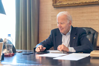 In this image provided by the White House, President Joe Biden speaks with Sen. Bob Casey, D-Pa., on the phone from the Treaty Room in the residence of the White House Thursday, July 21, 2022, in Washington. Biden says he's 'doing great' after testing positive for COVID-19. The White House said Biden is experiencing 'very mild symptoms,' including a stuffy nose, fatigue and cough. He's taking Paxlovid, an antiviral drug designed to reduce the severity of the disease.