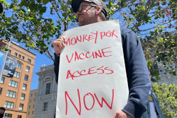 A man holds a sign urging increased access to the monkeypox vaccine during a protest in San Francisco, July 18, 2022. California's governor on Monday, Aug. 1, 2022, declared a state of emergency to speed efforts to combat the monkeypox outbreak, becoming the second state in three days to take the step.