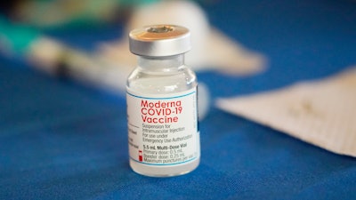 A vial of the Moderna COVID-19 vaccine rests on a table at an inoculation station next to Jackson State University in Jackson, Miss., Tuesday, July 19, 2022. Better-than-expected COVID-19 vaccine sales pushed Moderna past Wall Street’s 2022 second-quarter forecasts. The company said Wednesday, Aug. 3, 2022, that its Spikevax vaccine brought in $4.53 billion during the quarter.