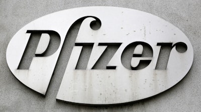 The Pfizer logo is displayed on the exterior of a former Pfizer factory, on May 4, 2014, in the Brooklyn borough of New York. Pfizer is buying sickle cell drug maker Global Blood Therapeutics in an approximately $5.4 billion deal as it looks to accelerate growth after its revenue soared during the pandemic. Both companies' boards have approved the deal, which still needs regulatory approval and approval from GBT shareholders.