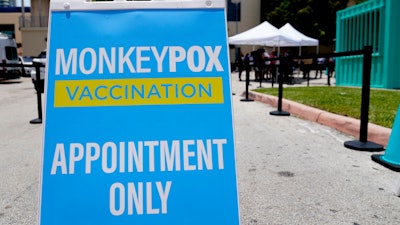 A sign for monkeypox vaccinations is shown at a vaccination site, Wednesday, Aug. 10, 2022, in Miami Beach, Fla. British health officials say the monkeypox outbreak across the country “shows signs of slowing” but that it's still too soon to know if the decline will be maintained. In a statement on Monday, Aug. 15 the Health Security Agency said authorities are reporting about 29 new monkeypox infections every day, compared to about 52 cases a day during the last week in June.