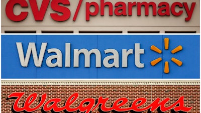 This undated combination of file photos show the signs of CVS, Walmart and Walgreens. A federal judge in Cleveland awarded $650 million in in damages on Wednesday, Aug. 17, 2022, to two Ohio counties that won a landmark lawsuit against national pharmacy chains CVS, Walgreens and Walmart, claiming the way they distributed opioids to customers caused severe harm to communities.