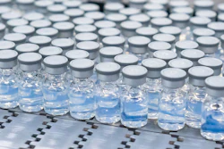 This August 2022 photo provided by Pfizer shows vials of the company's updated COVID-19 vaccine during production in Kalamazoo, Mich. U.S. regulators have authorized updated COVID-19 boosters, the first to directly target today's most common omicron strain.