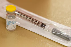A vial containing the monkeypox vaccine and a syringe is set on the table at a vaccination clinic run by the Mecklenburg County Public Health Department in Charlotte, N.C., Saturday, Aug. 20, 2022.