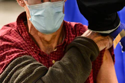 A man receives a flu shot in Brattleboro, Vt., on Tuesday, Oct. 26, 2021. Doctors have a message for vaccine-weary Americans: Don't skip your flu shot this fall 2022.