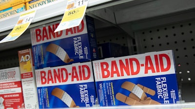 Band-Aids, from Johnson & Johnson, are displayed in a pharmacy, Thursday, July 16, 2020, in New York.