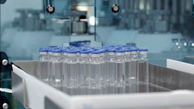 In this image provided by the Serum Institute of India, vials of freshly manufactured Novavax COVID-19 vaccines wait to be labeled in 2022, in Pune, India.