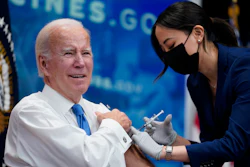 President Joe Biden receives his COVID-19 booster from a member of the White House medical unit during an event in the South Court Auditorium on the White House campus, Tuesday, Oct. 25, 2022, in Washington.