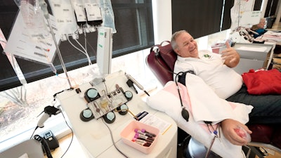 Matt Schermerhorn talks about donating blood at the Impact Life blood center, Friday, Nov. 11, 2022, in Davenport, Iowa.