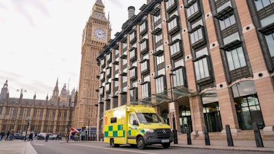 An ambulance is parked outside Portcullis House, backdropped by the Elizabeth Tower, commonly known as Big Ben, in London, Thursday, Dec. 1, 2022.