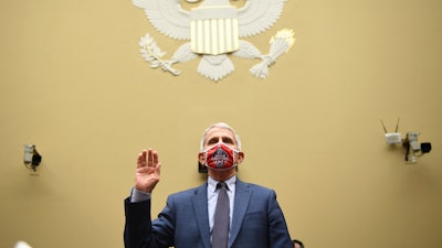 Dr. Anthony Fauci, director of the National Institute for Allergy and Infectious Diseases, is sworn in before a House Subcommittee on the Coronavirus crisis hearing, July 31, 2020 on Capitol Hill in Washington. Fauci steps down from a five-decade career in public service at the end of the month, one shaped by the HIV pandemic early on and the COVID-19 pandemic at the end.