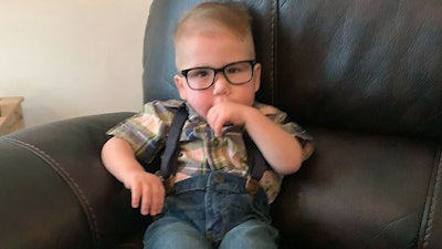 This photo provided by Reeanne Parisien shows her son, Greyson, relaxing at home in Belcourt, N.D., in August 2019. Greyson's journey to correct a heart defect led the Turtle Mountain Band of Chippewa Indians to designate a spot on tribal IDs for organ donation.