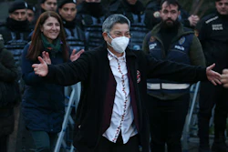 Turkish Medical Association President Dr. Sebnem Korur Fincanci gestures to friends and colleagues after being released from Bakirkoy women's prison in Istanbul, Turkey, Wednesday, Jan. 11, 2023.