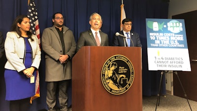 California Attorney General Rob Bonta, middle, speaks at a news conference in Sacramento, Calif., on Thursday, Jan. 12, 2023.