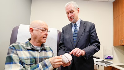 Yehuda Haber (left) speaks with Dr. Michael Schulder about the Alpheus Medical ultrasound clinical trial.