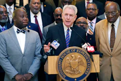 Dr. Dan Jones, the former chancellor of University of Mississippi, center, speaks at a news conference at the state Capitol in Jackson, where Democratic legislative leaders, criticized the Republican leadership's inaction on addressing the state's hospital crisis, Thursday, Feb. 2, 2023.