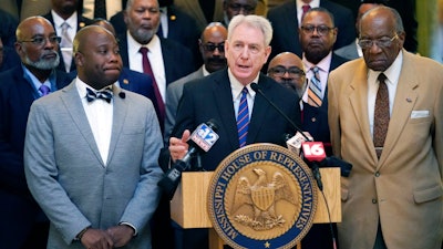 Dr. Dan Jones, the former chancellor of University of Mississippi, center, speaks at a news conference at the state Capitol in Jackson, where Democratic legislative leaders, criticized the Republican leadership's inaction on addressing the state's hospital crisis, Thursday, Feb. 2, 2023.