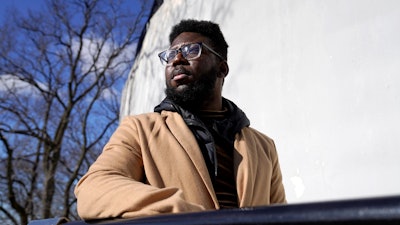 Somerville City Councilor Willie Burnley Jr., stands near the Prospect Hill Monument, Wednesday, Feb. 1, 2023, in Somerville, Mass.