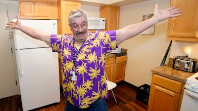 Thomas Marshall shows off the kitchen in his one bedroom apartment, in Sacramento, Calif., on February 24, 2023.