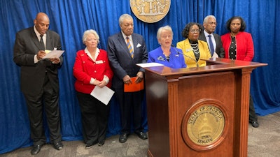 State Sen. Nan Orrock, D-Atlanta, flanked by supporters, announces federal complaints against Wellstar Health System, Wednesday, March 8, 2023, at the Georgia Capitol in Atlanta.