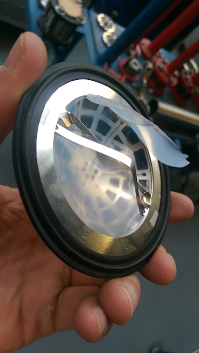 The new requirement is for a rupture disk that will allow air flow in and out of a sealed container when a small pressure differential arises without the disk bursting.