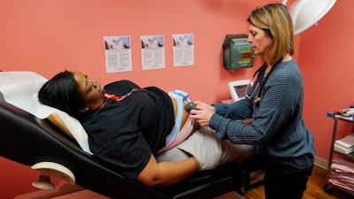 Dr. Michele Urban, M.D., cares for Tamara Spates, of Salisbury, Md., during a prenatal visit at a Chesapeake Health Care office in Salisbury, Md., Thursday, March 2, 2023.
