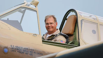 Precision Lens Founder Paul Ehlen pictured in a vintage plane.