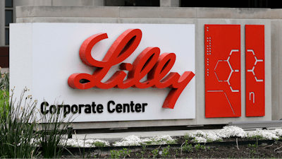 A sign for Eli Lilly & Co. stands outside their corporate headquarters in Indianapolis on April 26, 2017.