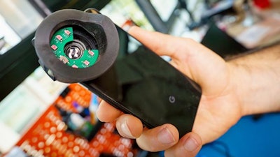 This attachment fits over a smartphone's camera to capture clear video of pupil size changes, which can offer clues about an individual's neurological functions. The device helps the camera see the pupil easily in dark eye colors.
