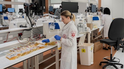 Staff work at the Magen David Adom's (MDA) Marcus National Blood Services Center, in Ramla, Israel, Sunday, Oct. 29, 2023. The blood bank and processing center is a subterranean and shielded facility that became operational a few days before Oct. 7, when Hamas launched a deadly attack on Israeli areas near the border with the Gaza Strip.