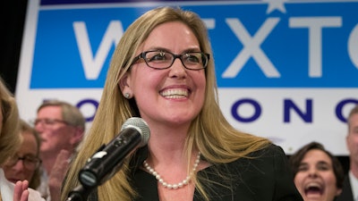 Democrat Jennifer Wexton speaks at her election night party after defeating Rep. Barbara Comstock, R-Va., Tuesday, Nov. 6, 2018, in Dulles, Va. Members of the House saved for likely the last vote of the year a bill they hope may one day stomp out Parkinson's disease.